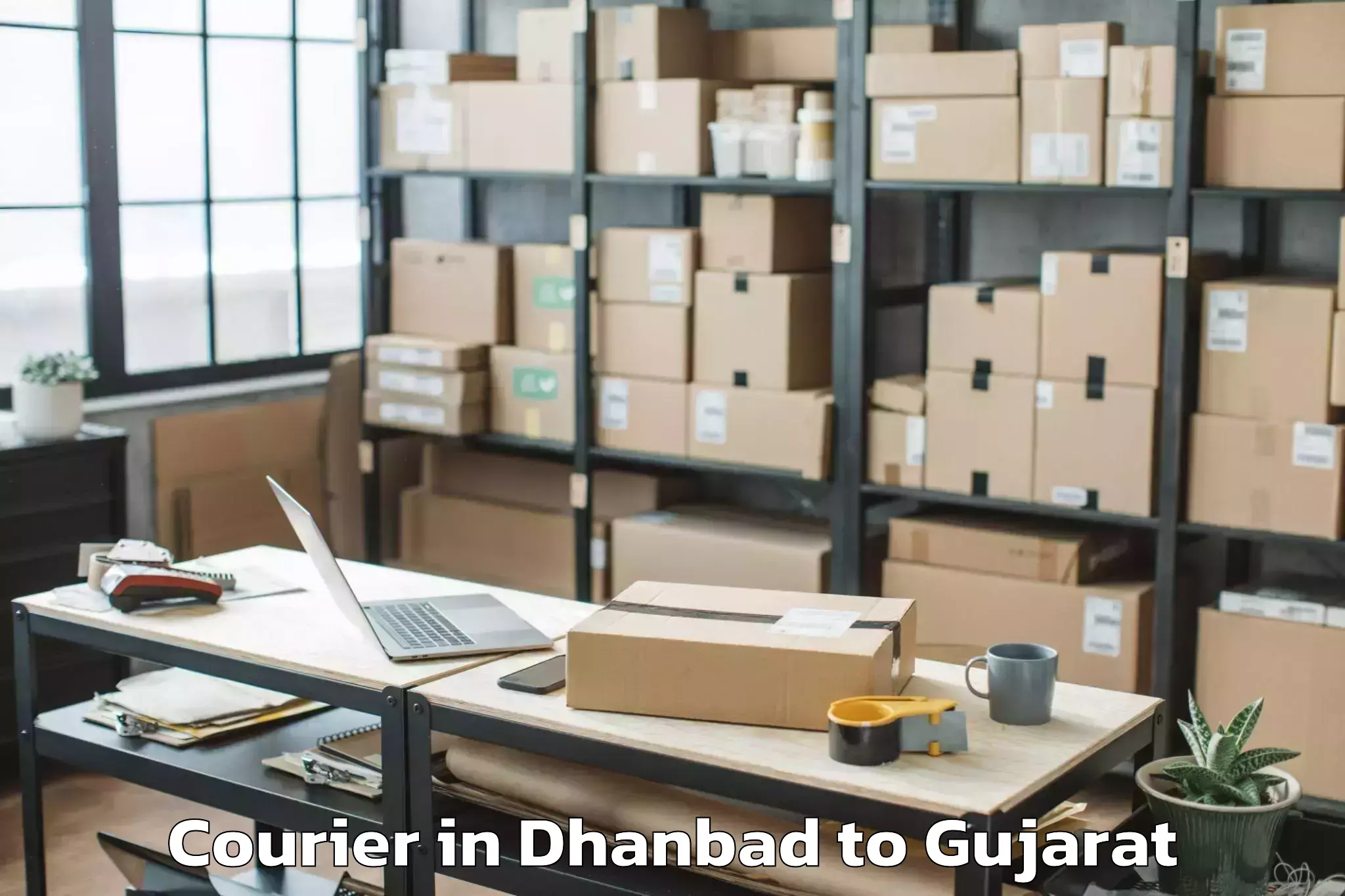 Get Dhanbad to Khedbrahma Courier